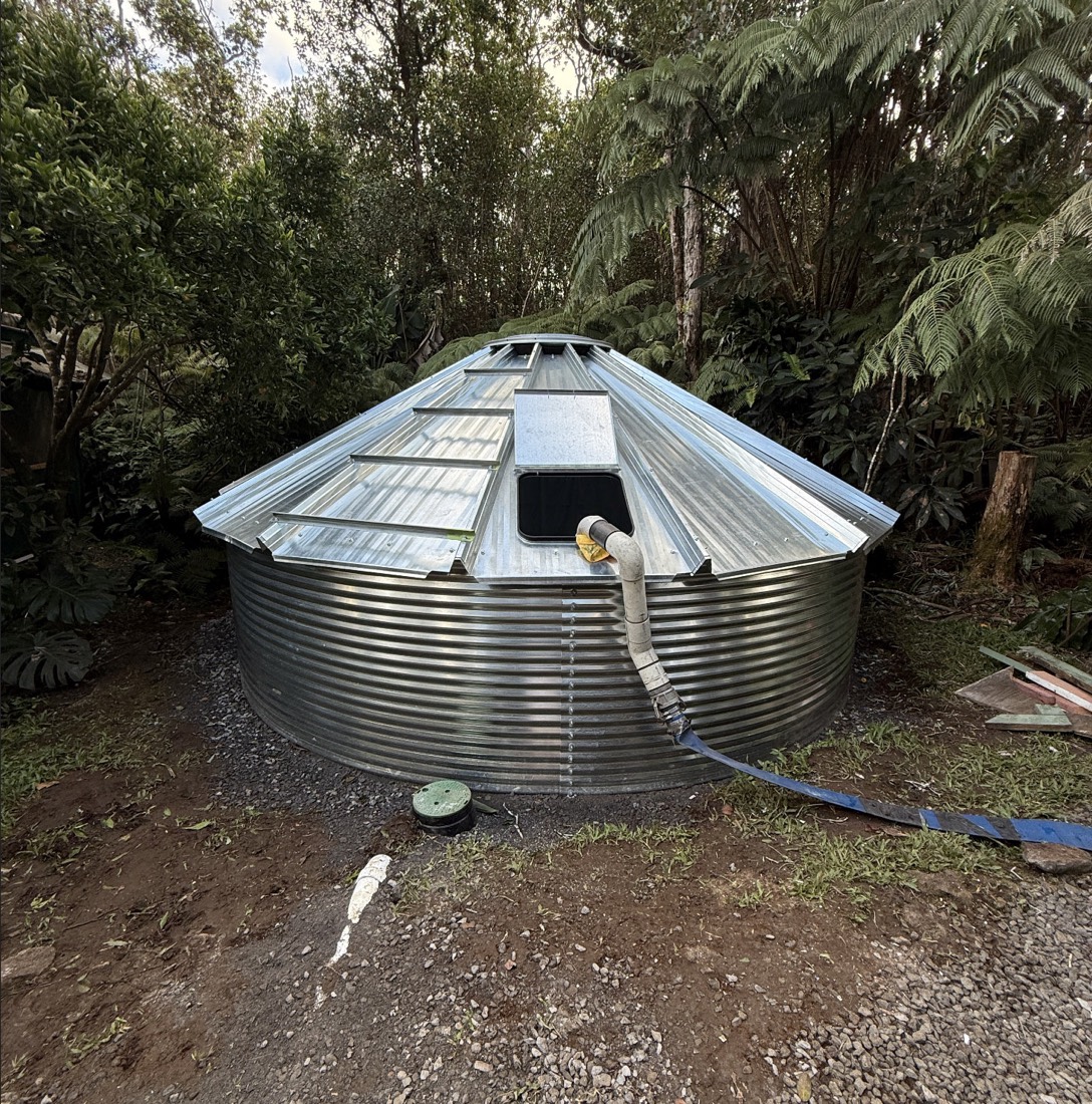 New catchment tank with metal roof build Big Island Hawaii